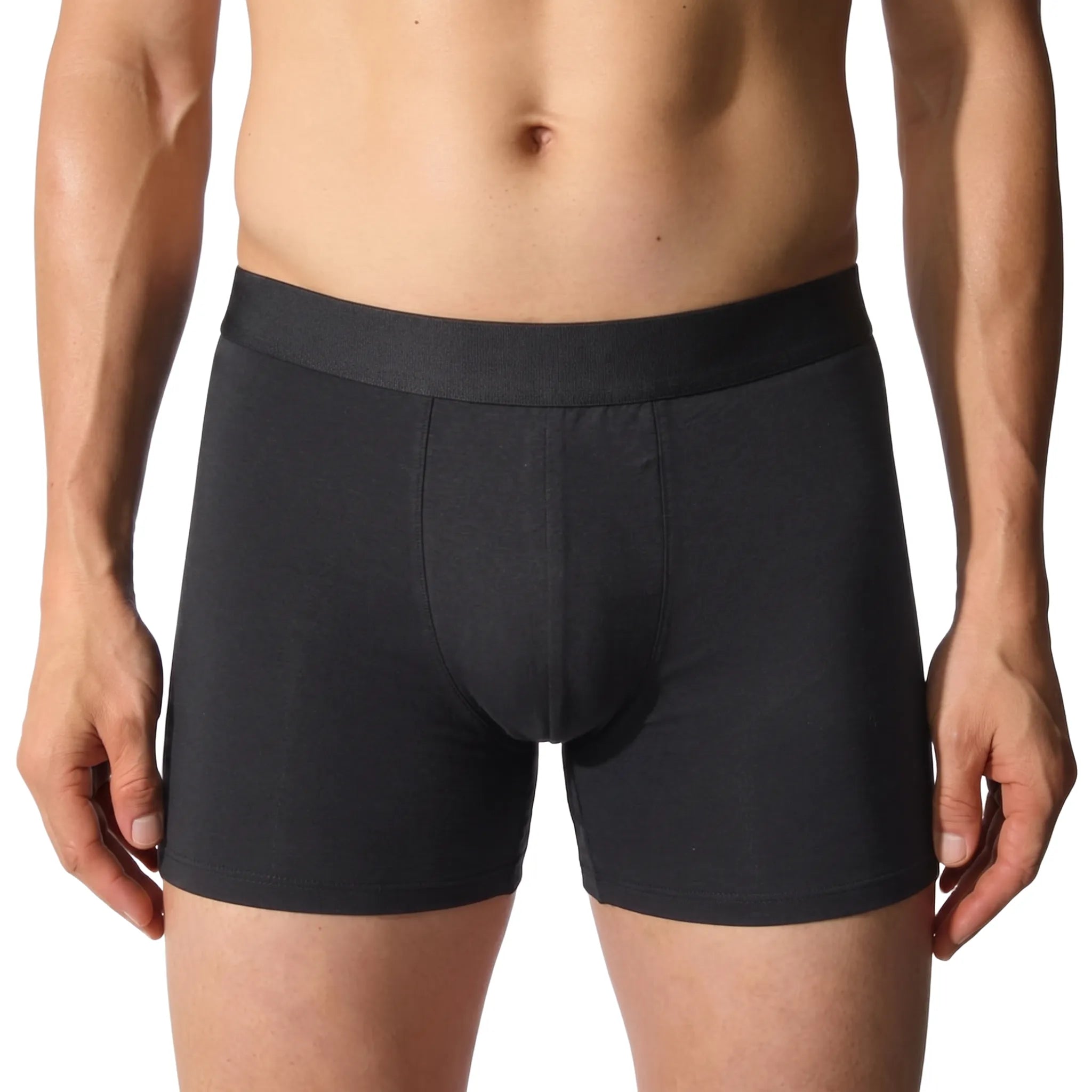 ātem boxer brief in black, worn front, showing the anatomical pouch and mid-length fit on the body